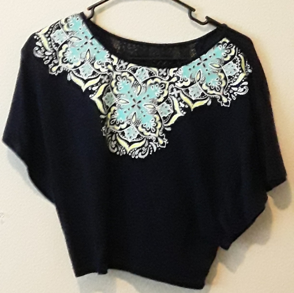 Blue shirt with designs
